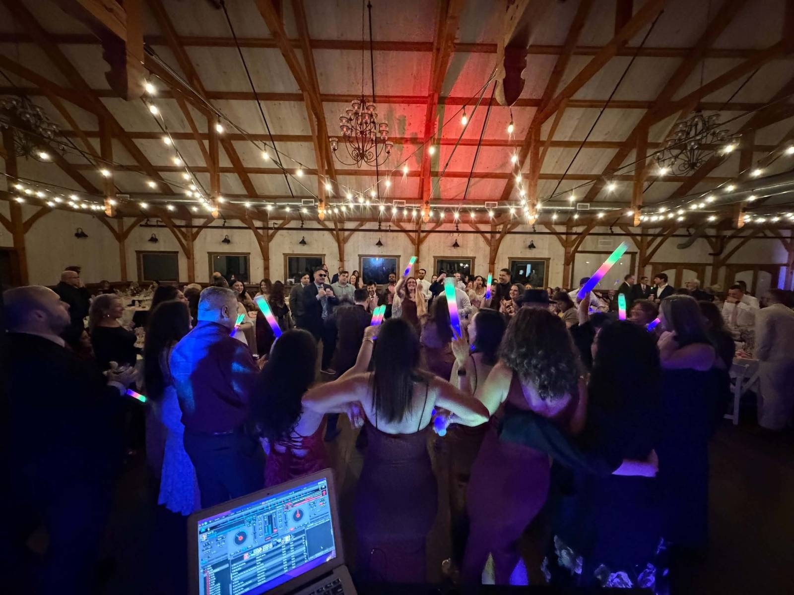 View from the DJ booth over a crowded barn dance floor